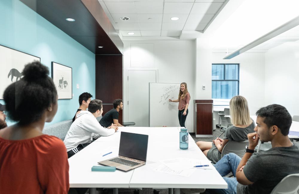 Instructor leading students in a workshop