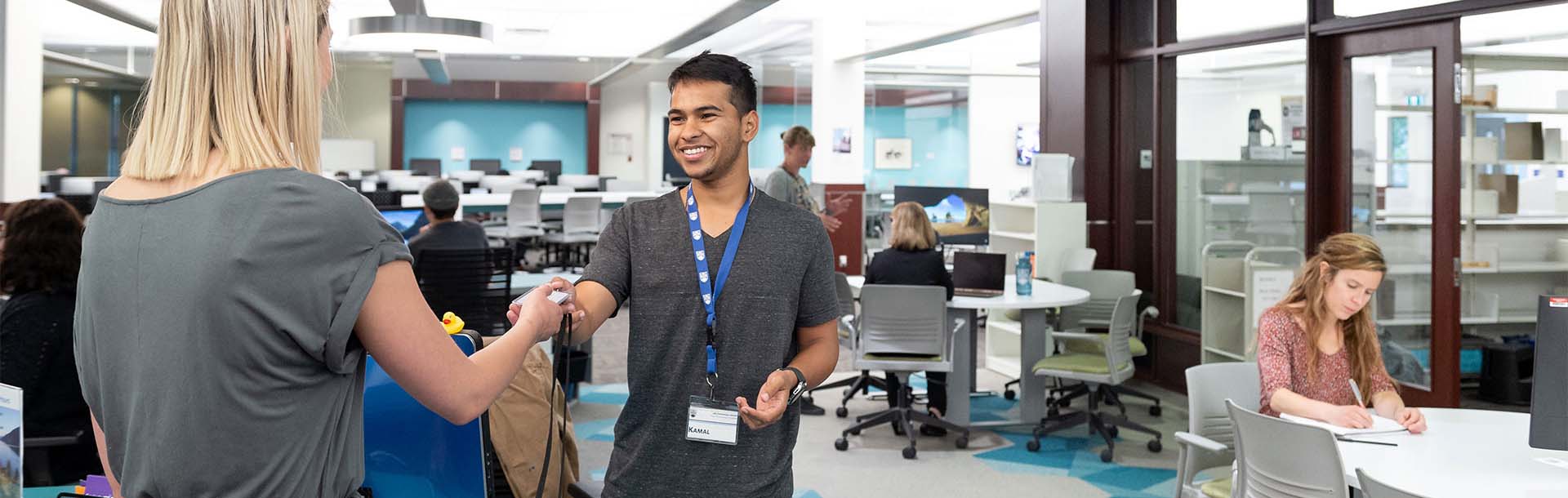 Student being welcomed at service desk