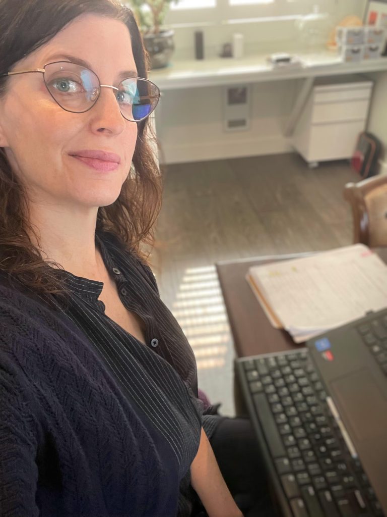 Alix Hawley seated at computer